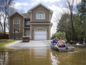The water levels were rising in Ottawa and Gatineau along the rivers Saturday May 11, 2019. Helen Theoret and her son Charles Theoret pack up her boat with a few items she came home to retrieve on Boulevard Hurtubise. Her and her husband had to leave their home.   Ashley Fraser/Postmedia