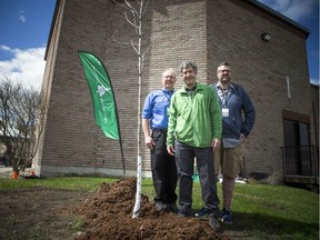 Arlington Woods Free Methodist Church held a bike rodeo Saturday May 11, 2019, and also planted a tree in their back yard. From left, Mike Hogeboom, lead pastor, Mike Rosen, president, Tree Canada, and Ben Spears, pastor family ministries, gathered around the newly planted tree for a photo.