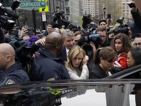 Felicity Huffman gets into a vehicle followed by her brother Moore Huffman Jr., outside federal, Monday, May 13, 2019, in Boston, where she pleaded guilty to charges in a nationwide college admissions bribery scandal.