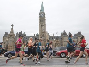 Runners take part in the 5K run during the Ottawa Race Weekend on Saturday, May 25, 2019.