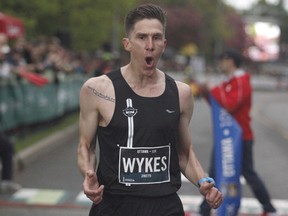 Dylan Wykes wins the men's Canadian 10k run at the Ottawa Race Weekend on Saturday, May 25, 2019.