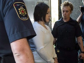 Terri-Lynne McClintic, convicted in the death of eight-year-old Woodstock, Ont., girl Victoria Stafford, is escorted into court in Kitchener, Ont., on Wednesday, September 12, 2012.