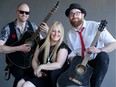 Singer Mags Gravelle, along with lead guitarist Matt Lytle (left) and singer/guitarist Tim Wilson, make up Karmacode's acoustic trio, which was playing The Bridge Public House May 8, 2019. At bigger gigs, the three join two other band members to play their Top-40 covers.