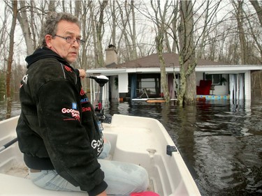 All but two of the 11 homes on Edgewater Trail are "wrecked, " says resident Perry McHugh. His house, which is raised by nine feet,  has water at its doorstep. The water is so high in homes (like the one here) that waves are throwing people's belongings around "like a washing machine." Floodwaters have risen so high in the Whitewater municipality — about 20 minutes east of Pembroke — about 100 households are cut off from the outside with only boats to get them in or out of their homes.  Julie Oliver/Postmedia