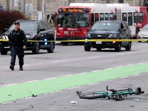 Ottawa Police block off the area where a cyclist was struck on Laurier Avenue near Elgin Street.
