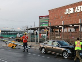 An Audi A4 ran over a traffic light on Hunt Club in Ottawa near the Jack Astor's.