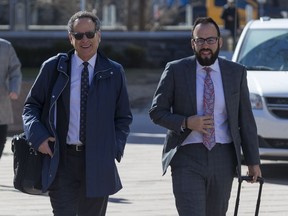 The defence team for Const. Daniel Montsion of Michael Edelson (L) and Solomon Friedman arrives at the Ottawa Courthouse on on April 17, 2019. Errol McGihon/Postmedia
