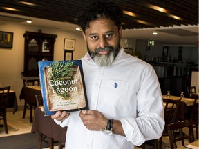 Coconut Lagoon chef-owner Joe Thottungal, with his first cookbook.