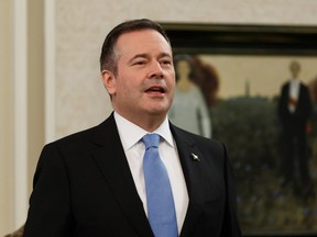 Premier Jason Kenney sings the national anthem before being sworn in as Alberta's 18th Premier at Government House during a ceremony in Edmonton, on Tuesday, April 30, 2019.