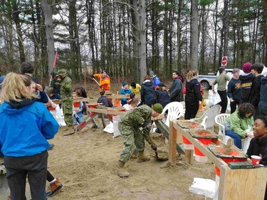 Students from Sacred Heart High School in the Ottawa Catholic School Board  took a field trip on Wednesday May 1 to help out with flood relief by pitching in with armed forces and other volunteers to fill sandbags.