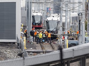 OC Transpo employees work on a train that derailed in the yards at 825 Belfast Road in Ottawa on May 3, 2019.