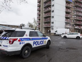 Ottawa police vehicles at an apartment building at 251 Donald St. after a body was found on May 14, 2019. Errol McGihon/Postmedia