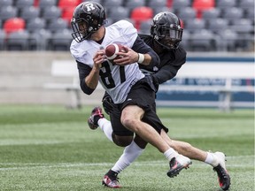 Wide receiver Seth Coate makes a catch and eludes a tackle during Ottawa Redblacks rookie camp at TD Place on Wednesday, May 15, 2019. Errol McGihon/Postmedia