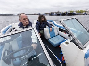 Roxanne Briand and her spouse, Pierre Cardinal, have to travel by boat to their home on Rue Fer-à-Cheval in Masson-Angers.