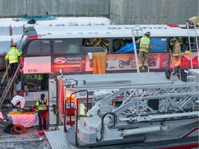 First responders attend to victims at the scene of the Westboro Station bus crash near Tunney's Pasture on January 11, 2019.
