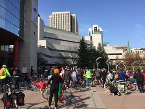 Cyclists were out Wednesday morning remembering a fellow cyclist who was killed in a hit-and-run last week and demanding that city councillors put safe cycling spaces on the agenda. Photo by Jon Willing/Postmedia