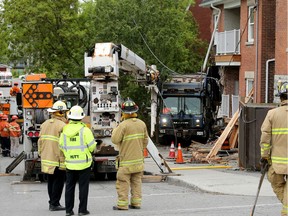 A garbage truck plowed into a multi-unit house on Nelson Street near Laurier Monday morning (May 27, 2019). Julie Oliver/Postmedia