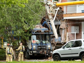 A garbage truck plowed into a multi-unit house on Nelson Street near Laurier Monday morning (May 27, 2019).