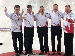 Celebrating a world senior curling championship victory in Norway are, left to right, skip Bryan Cochrane, third Ian MacAulay, second Morgan Currie, lead Ken Sullivan and alternate Paul Adams.