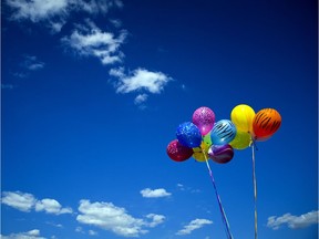 July 13, 2013 --  Balloons are held in the sky near the main stage Saturday July 12, 2013 at Ottawa Bluesfest. The hot weather and blue skies were welcomed by many Saturday.   (Ashley Fraser for The Ottawa Citizen)