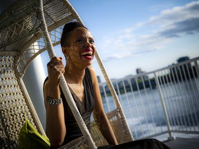 Performer Kellylee Evans takes a second to enjoy a swing on the balcony overlooking the Ottawa River.