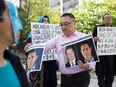 Uyghur activists protest outside a court appearance for Huawei Chief Financial Officer, Meng Wanzhou, at the British Columbia Supreme Court in Vancouver, on May 8, 2019.