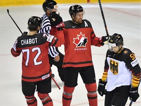 Canada's Mark Stone (C) and Thomas Chabot celebrate scoring during the IIHF Men's Ice Hockey World Championships Group A match between Canada and Germany on May 18, 2019 in Kosice, Slovakia.