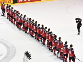 Canada's players line up after the IIHF Men's Ice Hockey World Championships quarter-final match between Canada and Switzerland on May 23, 2019 at the Steel Arena in Kosice, Slovakia.