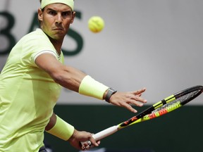 TOPSHOT - Spain's Rafael Nadal eyes the ball before playing a forehand return Germany's Yannick Hanfmann during their men's singles first round match on day two of The Roland Garros 2019 French Open tennis tournament in Paris on May 27, 2019.