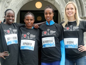 Natasha Wodak (right) captains her team, comprised of (from left) Peres Jepchirchir (Kenya), Paskalia Kipkoech (Kenya) and Get Alemayehu (Ethiopia), who are running for the Canadian Cancer Society. In advance of Ottawa's Race Weekend, members of the Ottawa 10K Dream Teams assembled at Ottawa City Hall for some pictures and interviews with the media. The Dream Teams are composed of some of the top runners in the sport, who will run not only for the 10K title, but also for various local charities.