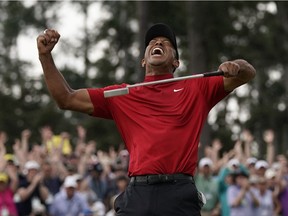 Tiger Woods reacts as he wins the Masters golf tournament Sunday, April 14, 2019, in Augusta, Ga.