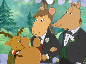 Mr. Ratburn, right, walks down the aisle with his soon-to-be husband.