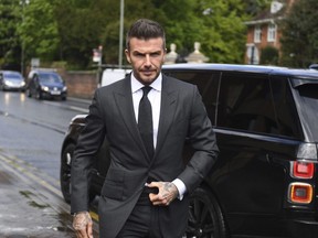 Soccer star David Beckham arrives at Bromley Magistrates Court for a hearing after he was spotted using his mobile phone while driving his Bentley, in London, Thursday, May 9, 2019.