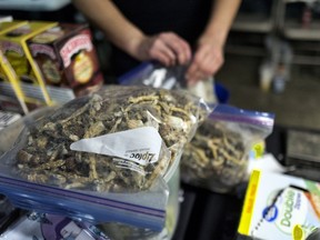 A vendor bags psilocybin mushrooms at a pop-up cannabis market in Los Angeles on Monday, May 6, 2019. Voters decide this week whether Denver will become the first U.S. city to decriminalize the use of psilocybin, the psychedelic substance in "magic mushrooms."