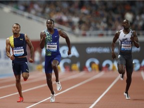 From left, Andre de Grasse of Canada, Aaron Brown of Canada, and Kyle Greaux of Trinidad and Tobago compete in the men's 200-meters during the Diamond League Track and Field meet in Shanghai, China, Saturday, May 18, 2019.