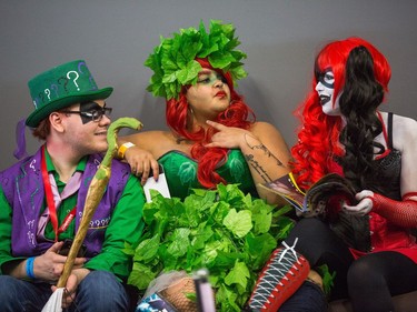 Dressed as Riddler (left to right), Poison Ivy and Harley Quinn, Jamieson Watson, Alysha Lee and Dantee Baptiste take a break from wandering around all the displays and workshops as the 8th edition of Ottawa Comiccon gets underway at the EY Centre and runs through until Sunday. Wayne Cuddington / Postmedia