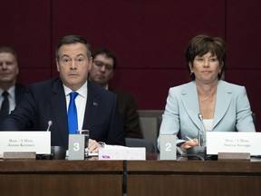 Alberta Premier Jason Kenney and Minister of Energy for Alberta Sonya Savage, right, prepare to appear at the Standing Senate Committee on Energy, the Environment and Natural Resources about Bill C-69 at the Senate of Canada Building on Parliament Hill in Ottawa on May 2, 2019. Environmental groups targeted by Alberta Premier Jason Kenney are shrugging off the new government's promised $30-million "war room" to fight criticisms of the province's energy industry.