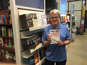 Ottawa author and Citizen columnist Randall Denley at a book signing in Carlingwood Mall on May 19 for his new mystery novel, Spiked, which follows a fictional Citizen crime reporter.