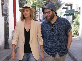 This image released by Lionsgate shows Charlize Theron, left, and Seth Rogen in a scene from "Long Shot."