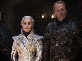 This image released by HBO shows from left Conleth Hill, Emilia Clarke, Iain Glen in a scene from "Game of Thrones.