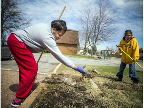 A group of residents in the Craig Henry area, which was hit by the tornado last year, came together to clean up their neighbourhood Saturday, May 4, 2019. Pauline Morgan, left, and Marie Weerasooriya-Epps work togeother Saturday morning.   Ashley Fraser/Postmedia