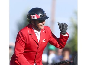Eric Lamaze, from Canada, celebrates his clear second round on horse Coco Bongo in the Nations' Cup during the Masters at Spruce Meadows in Calgary on Saturday, September 8, 2018. The Nations' Cup was won by Germany and Canada finished second. Jim Wells/Postmedia