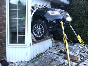A vehicle pokes out of a bay window on Ingram Crescent after plowing through a residence.