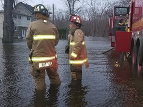 Firefighters at a house fire in Constance Bay Wednesday morning.