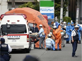 Rescuers work at the scene of a stabbing attack in Kawasaki, near Tokyo, on Tuesday.