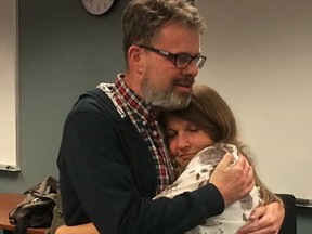 Kevin and Julia Garratt embrace at Vancouver airport following his return to Canada