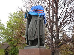 A statue depicting St. Volodymyr outside the Cathedral of Sts. Vladimir and Olga in Winnpeg's north end is shown on Friday May 24, 2019. A Winnipeg church's bronze statue of a prominent saint that was once blessed by a pope has been decapitated.