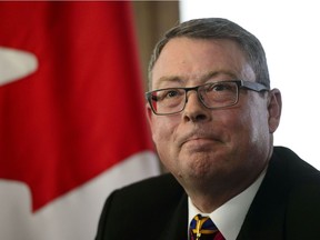 Vice-Admiral Mark Norman reacts during a press conference in Ottawa on Wednesday.