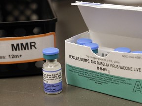 FILE - This May 15, 2019 file photo shows a vial of a measles, mumps and rubella vaccine at a clinic in Vashon Island, Wash. On Thursday, May 30, 2019, U.S. health officials reported this year's U.S. measles epidemic surpassed a 25-year-old record, and experts say it's not clear when the wave of illnesses will stop. There were 971 cases so far this year, eclipsing the 963 measles illnesses reported for all of 1994.