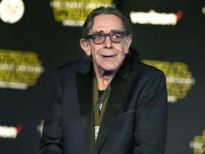 FILE - In this Dec. 14, 2015, file photo, Peter Mayhew arrives at the world premiere of "Star Wars: The Force Awakens" in Los Angeles. Mayhew, who played the rugged, beloved and furry Wookiee Chewbacca in the "Star Wars" films, has died. Mayhew's family said in a statement that he died at his home in Texas on Friday, April, 26, 2019. He was 74. No cause was given.